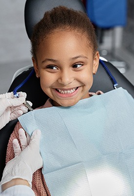 Girl smiling at the dentist