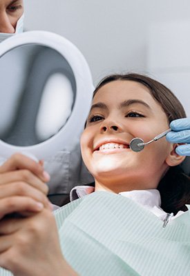 Child smiling at the dentist