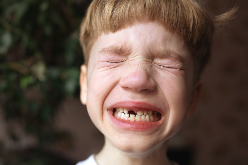 Child crying due to a lost tooth